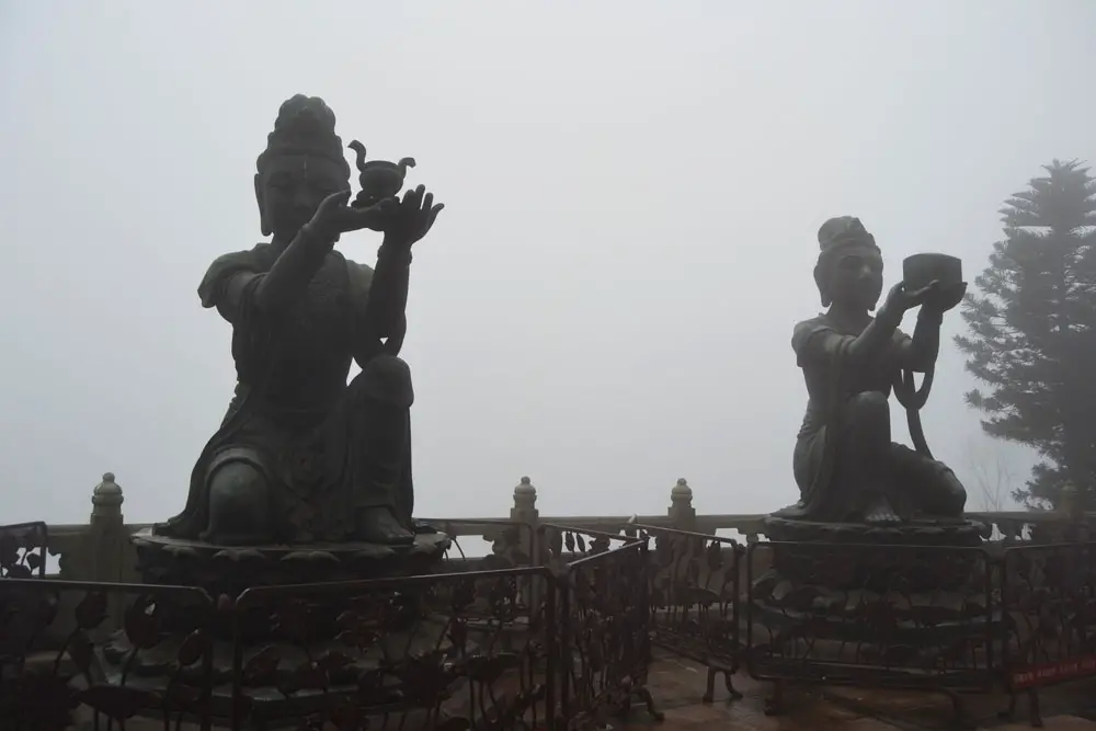Buddhist statues praising Tian Tan Buddha in Hong Kong